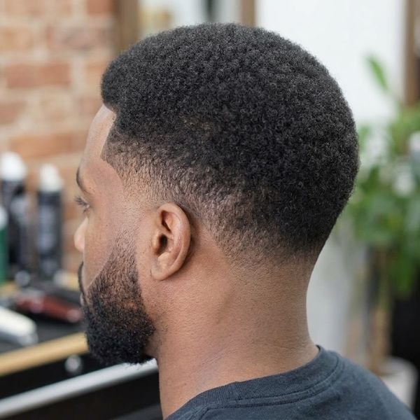 8. Low Afro With Mid Taper Fade